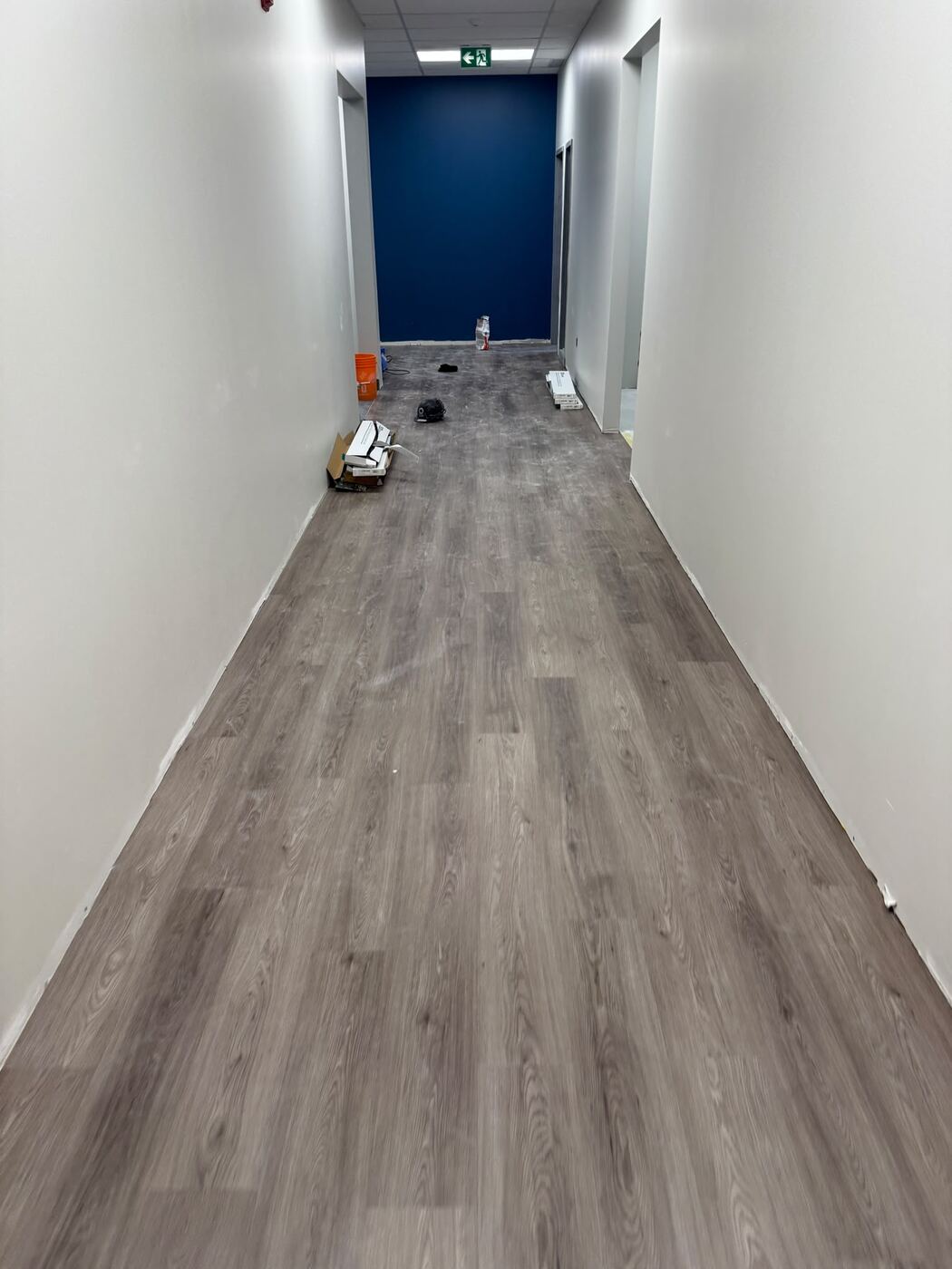 Finished LVT plank flooring in a commercial hallway